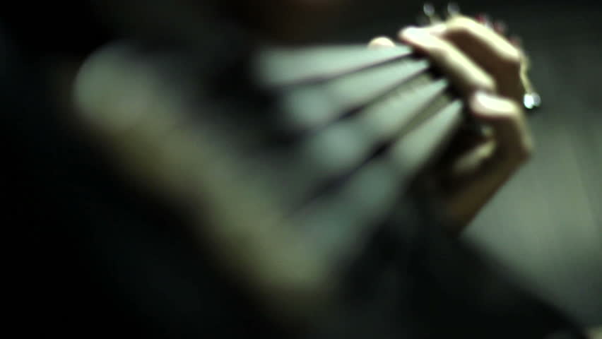 Man playing electrical bass guitar