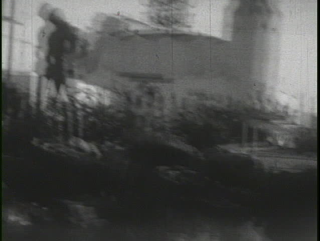 CALIFORNIA, USA - CIRCA 1930s: Young kids and a baby play in the backyard of a suburban house circa 1930s in California.