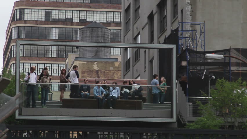 NEW YORK - OCTOBER 4: People sit in the Highline park, October 4, 2011 in New York. The High Line is a 1-mile (1.6 km) New York City linear park built on a 1.45-mile section of the former elevated freight railroad spur called the West Side Line.
