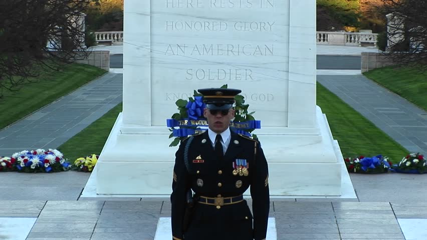 WASHINGTON, D.C. - CIRCA 2009: A decorated soldier stands in front of a monument and gives a speech.