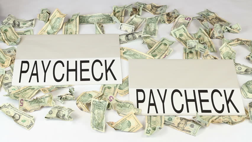 Male walking from paycheck to paycheck with crumpled money scattered about on the white floor.