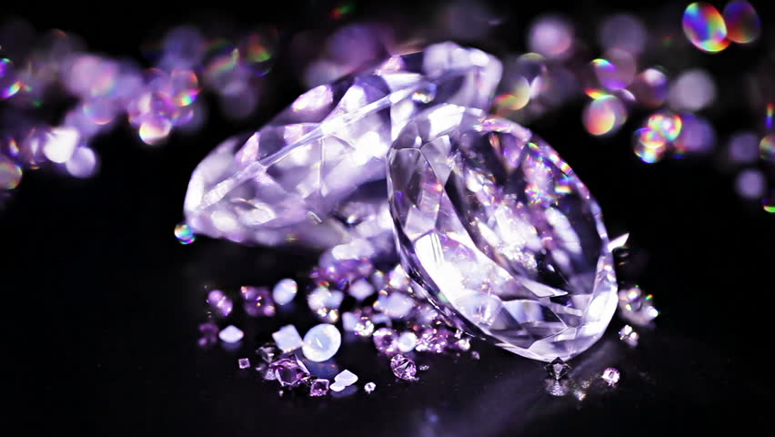 Big diamonds with many violet small one rotating over dark background