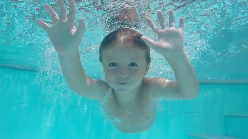 Beauty Young Woman Swimming Underwater In Swimming Pool photo