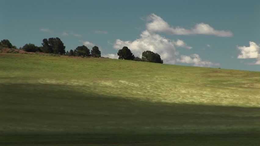 Wind blowing across grassy hills outside Zion National Park in Utah