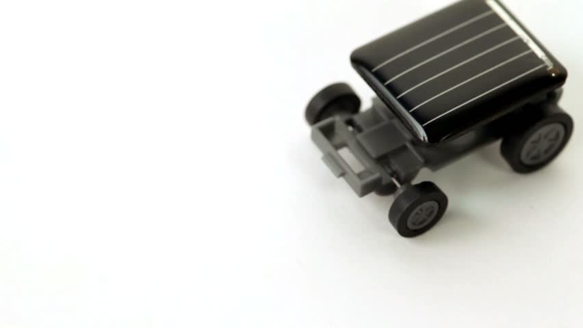 Toy car on solar panel is not moving, with an increase in light flux, it begins to move