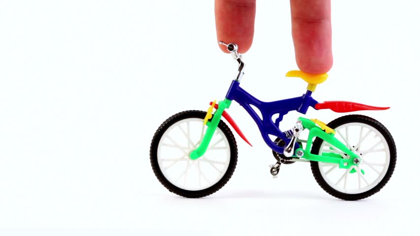 Fingers ride on toy bike, then other fingers came on fingerboard