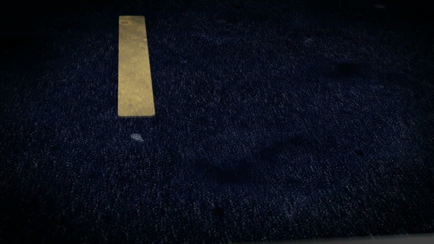 Through the asphalt.