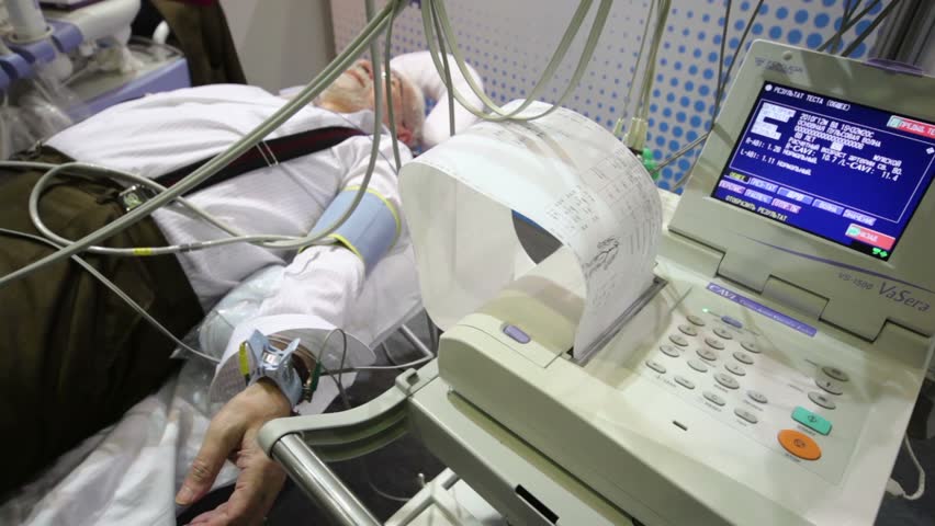 MOSCOW - DEC 8: Man lying at exhibition Zdravookhraneniye2010, 20th International Exhibition for Health Care, Medical Engineering and Pharmaceuticals at Expocentre, Dec 8, 2010, Moscow, Russia