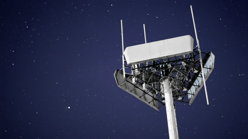 A transmitter remains static against a moving night sky