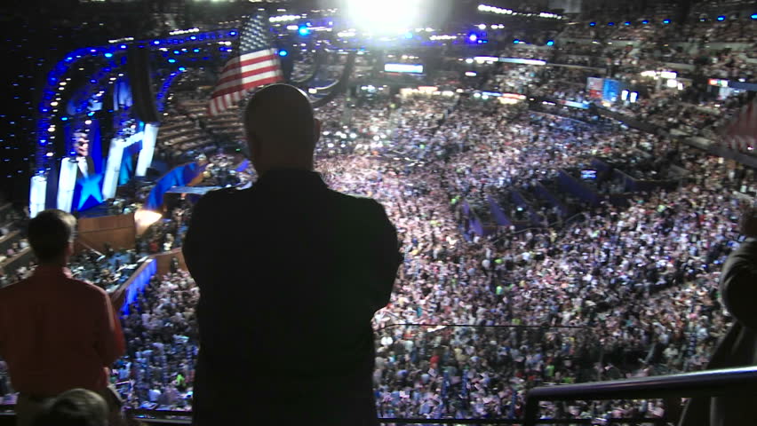 DENVER, COLORADO - CIRCA 2008: A packed stadium at Pepsi Center clap and cheer as Bill Clinton delivers a pro-Barack Obama speech at the 2008 Democratic National Convention.