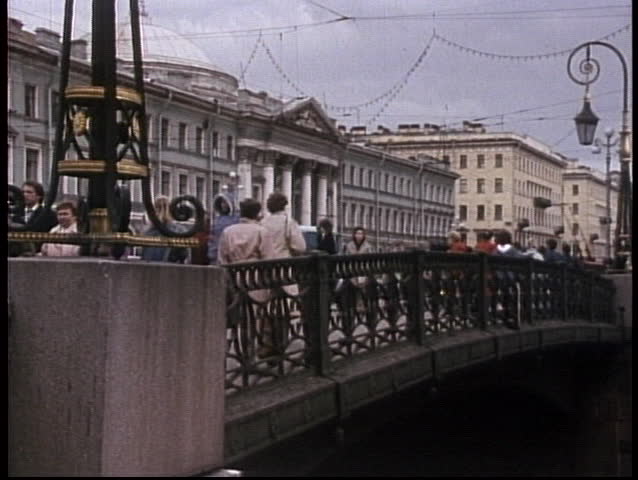 MOSCOW, RUSSIA - CIRCA 1970: Crowds mill on the streets of the old Soviet Union in this archival shot.