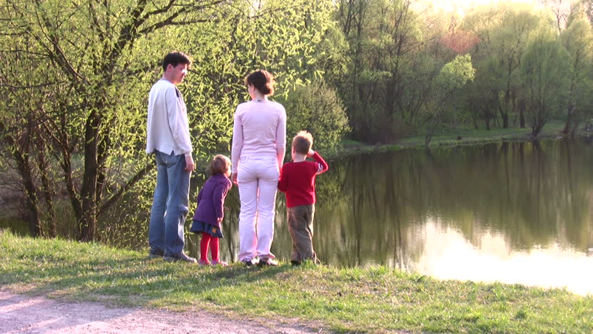 family on spring pond