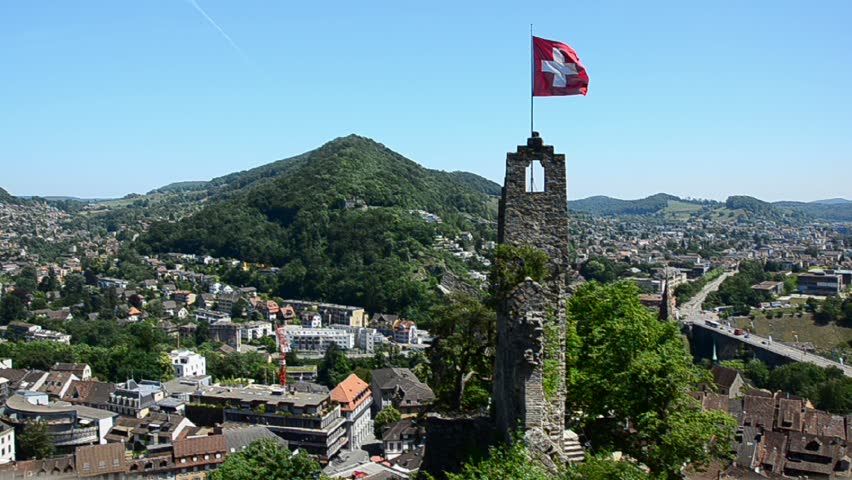 Castle ruins and Swiss flag at Baden, Switzerland. 