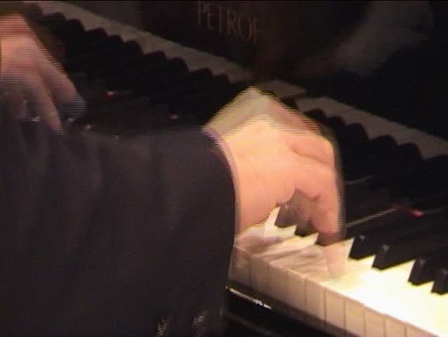 Pianist playing piano,with pretty haul of the hands