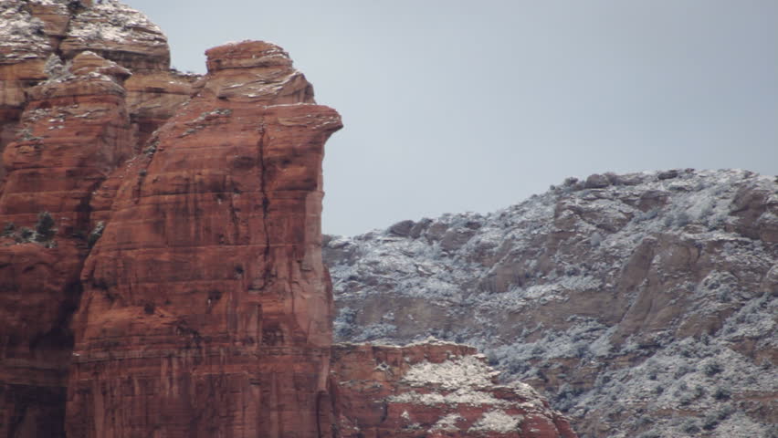 A serene view of the red rocks and Coffee Pot Rock in Sedona, Arizona after the first snow of the season.