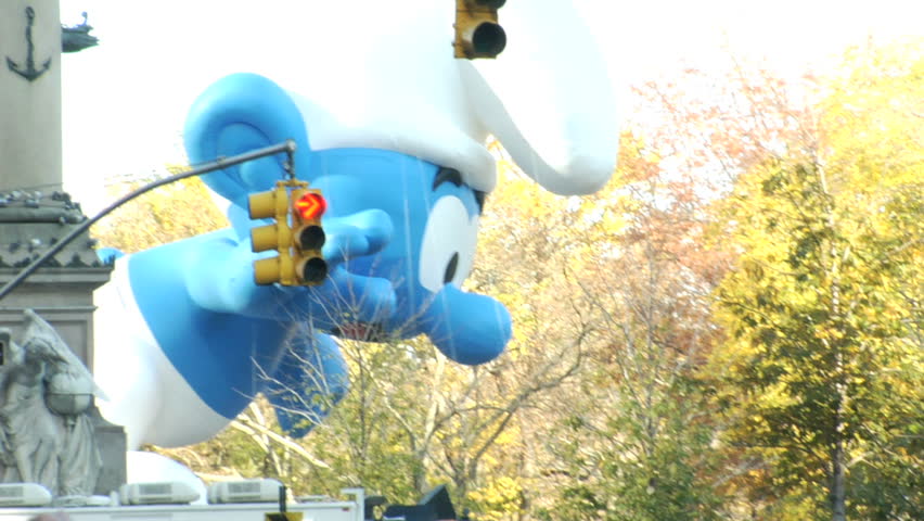 NEW YORK - NOVEMBER 24: Smurf Balloon passes Columbus Circle at the Macy's Thanksgiving Day parade, November 24, 2011 in New York 