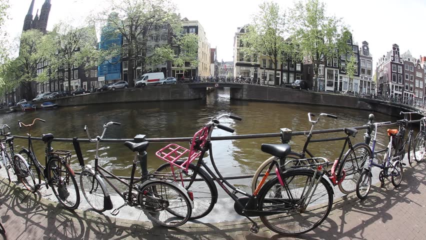 Bicycles line the railings in front of the canal circa April 2011 in Amsterdam.