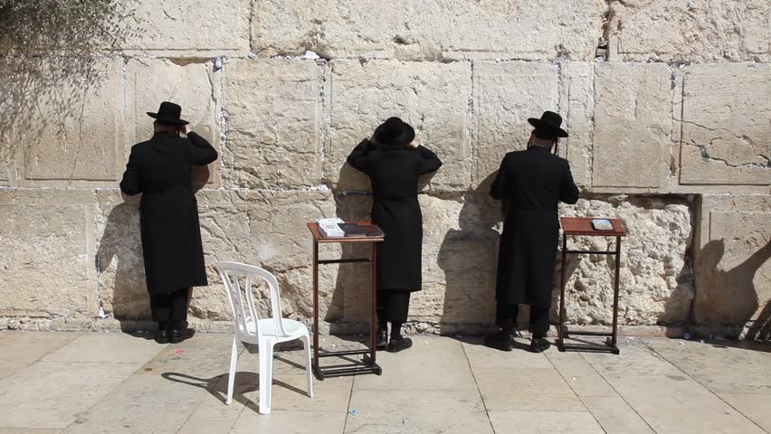 JERUSALEM, ISRAEL - CIRCA OCT 2011: Orthodox Jews pray at the Western Wall circa October 2011 in Jerusalem.