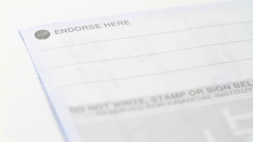 authenticating a check for deposit with a signature