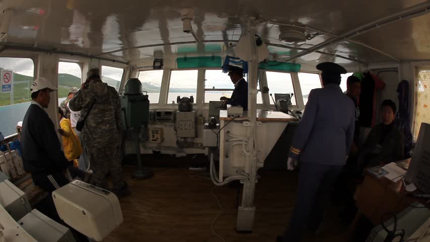 LAKE HOVSGOL, MONGOLIA - JULY 18, 2009: Boat captains man the command bridge on July 18, 2009 on Lake Hovsgol.
