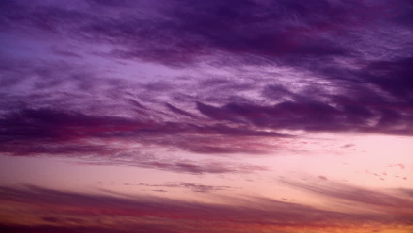 Clouds, fast moving with purple, pink, blue and the reddish hues of a deep sunset. A beautiful desert sunset in Israel near the Dead Sea.  02/26/2011