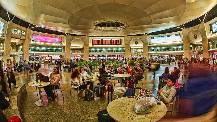 BEN GURION AIRPORT, ISRAEL - MAR 2, 2011: Timelapse of people walking and sitting in duty-free area of Ben Gurion Airport on March 2, 2011 in Israel.