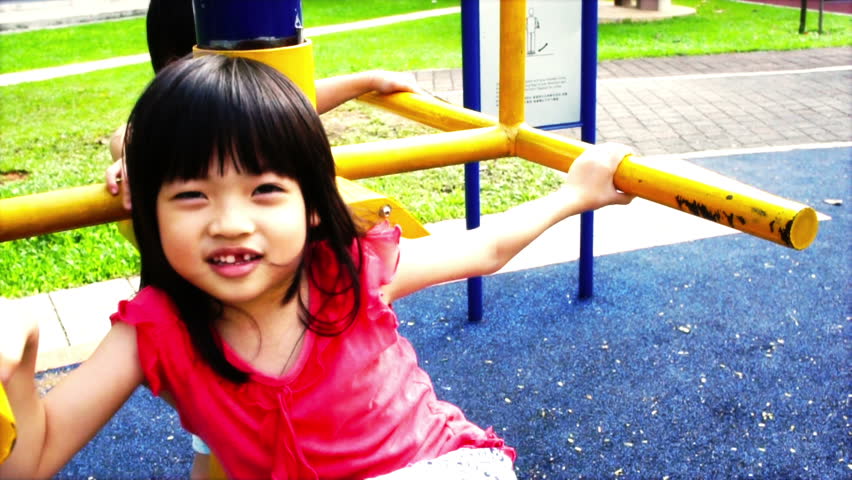 Asian Sibling, brother and sister playing at the playground