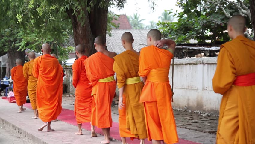 Young mendicants begging tour in Laos