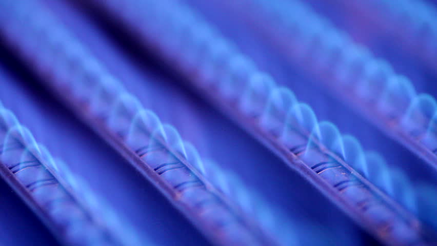Blue flames of a gas burner inside of a boiler
