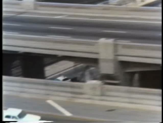 Aerial view of police cruiser chasing white car