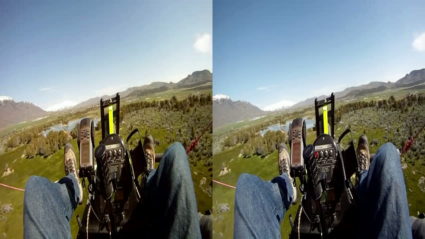3D stereoscopic split screen view aerial flying an ultralight aircraft from view of the pilot during flight over small rural ponds.