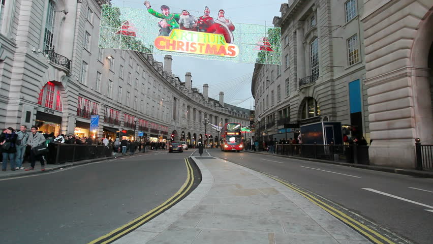 LONDON, UK - DECEMBER 27: Double decker busses pass under Christmas decoration in Regent Street in London, UK on December 27 , 2011. Regent Street is one of the main shopping streets in London.