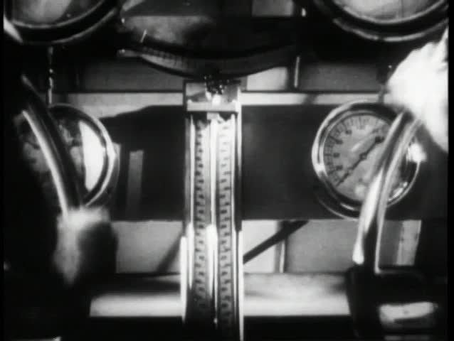 Rear view hands steering submarine