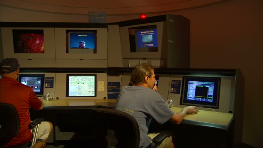 HILO, HAWAII - CIRCA NOVEMBER 2006: Men working at the Imiloa Astronomy Center 