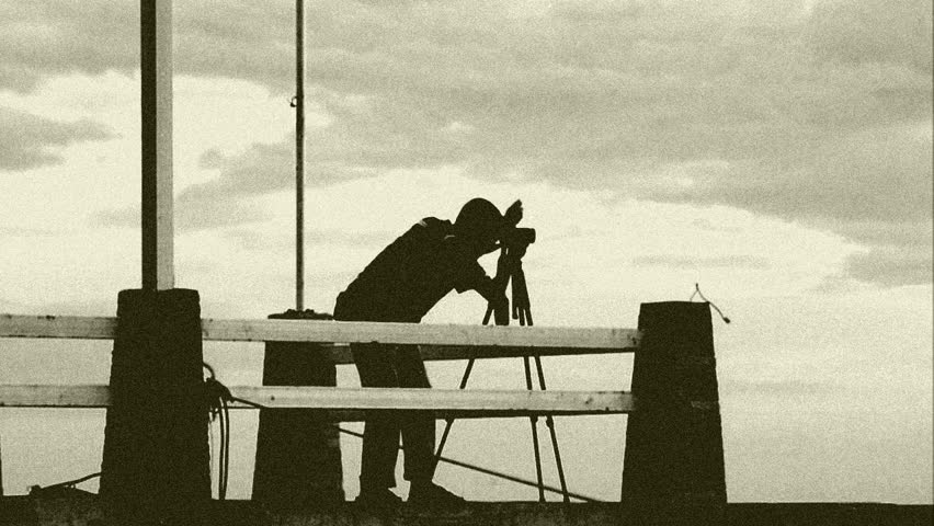 stylized for old movie photographer with tripod and camera