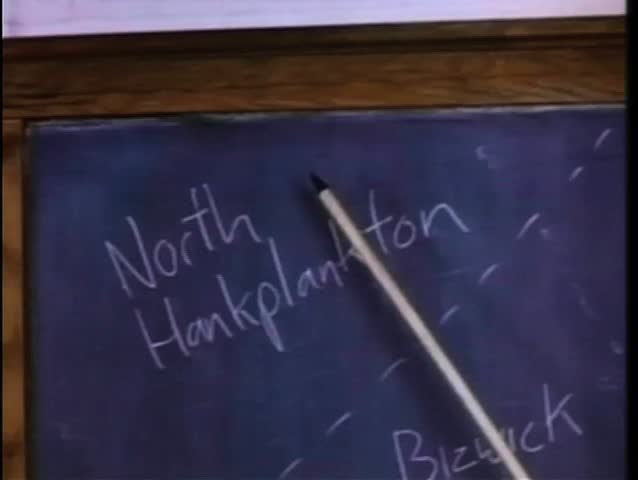 Pointer indicating several  locations on map drawn on blackboard