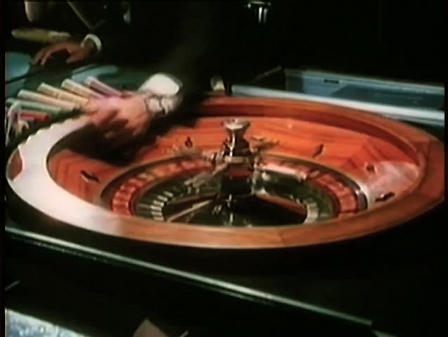 Close-up of nervous hands playing roulette in casino