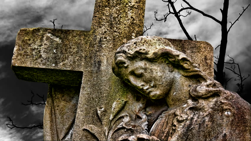 Timelapse clouds flowing past graveyard statue