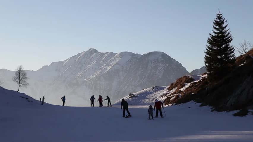 Skiers on a hill