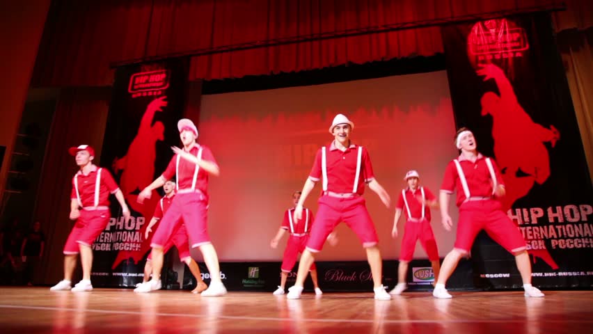 MOSCOW - MARCH 27: Seven boys from ABZAC CREW in red clothes dance modern style on stage at HHI - Cup of Russia, Championship IV on March 27, 2011 in Moscow, Russia.