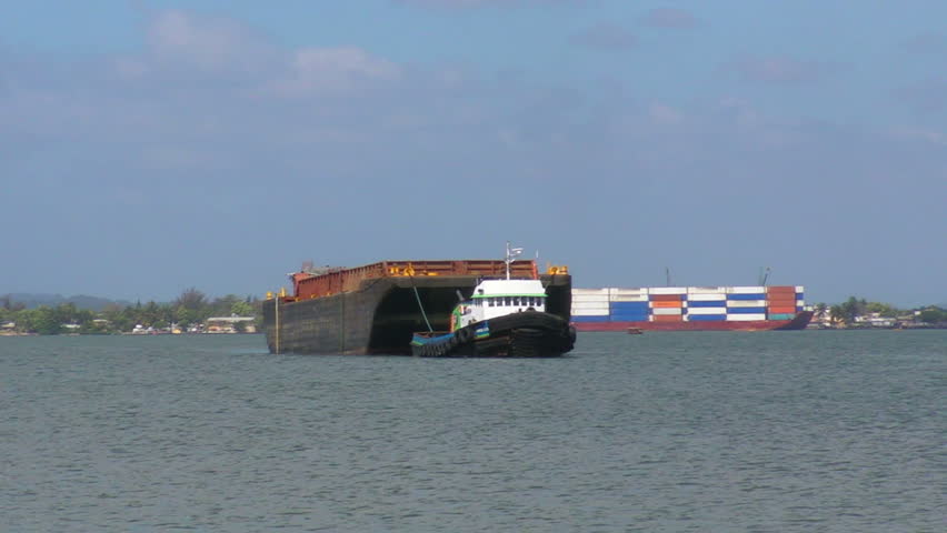 Tug boat stopping barge in San Juan Harbor July 6, 2011