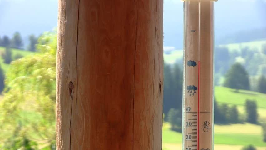 Thermometer on a porch with Mountain View shows hot summer temperature