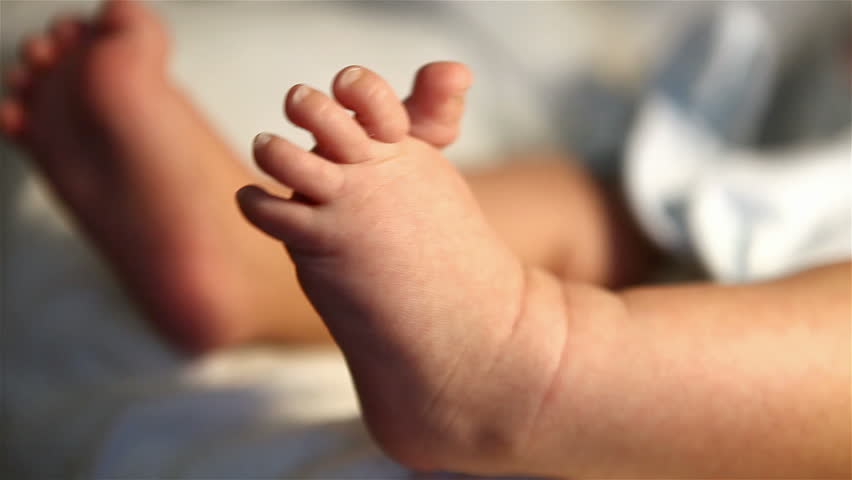 little feet a newborn baby