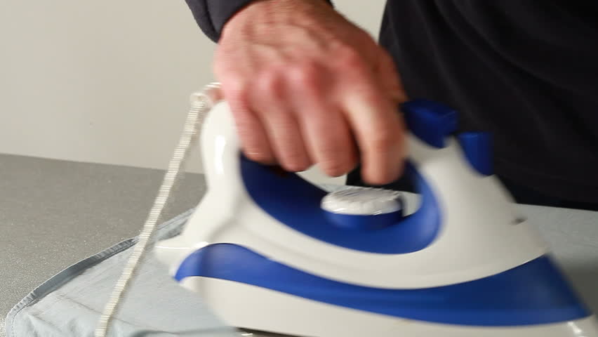 Man ironing a shirt