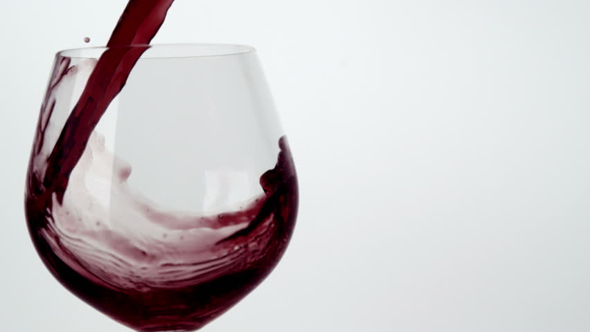 Slo-motion wine poured into glass
