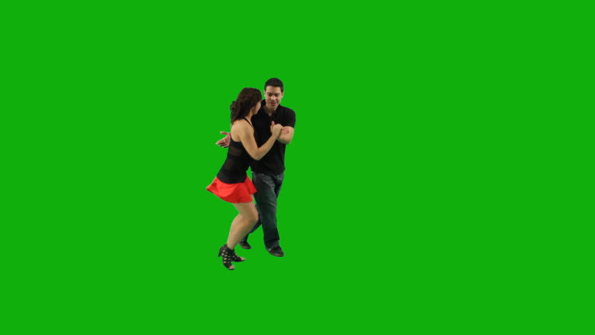 A couple dancing salsa against greenscreen 