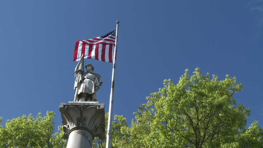 Patriotic statue and American flag