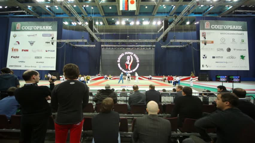 MOSCOW - FEBRUARY 19: Spectators look as sportsmen fight on tatami in huge hall in Olympiysky Sports Complex at World Cup 2011 KUDO on February 19, 2011 in Moscow, Russia.