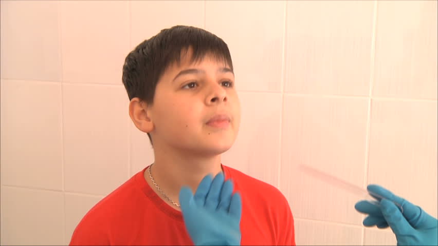 doctor examines the boy his throat 1