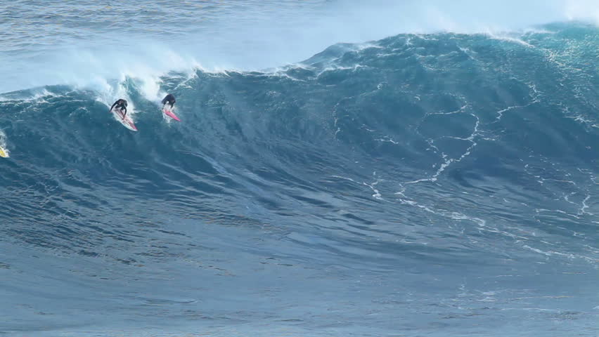 MAUI, HI - January 31: Professional surfers ride a giant wave at the legendary big wave surf break known as "Jaws" during one the largest swells of the winter January 31, 2012 in Maui, HI.